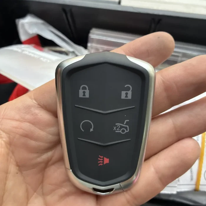 Replacement Cadillac smart key fob programmed in the locksmith van
