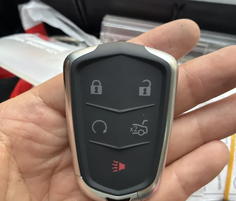 Replacement Cadillac smart key fob programmed in the locksmith van