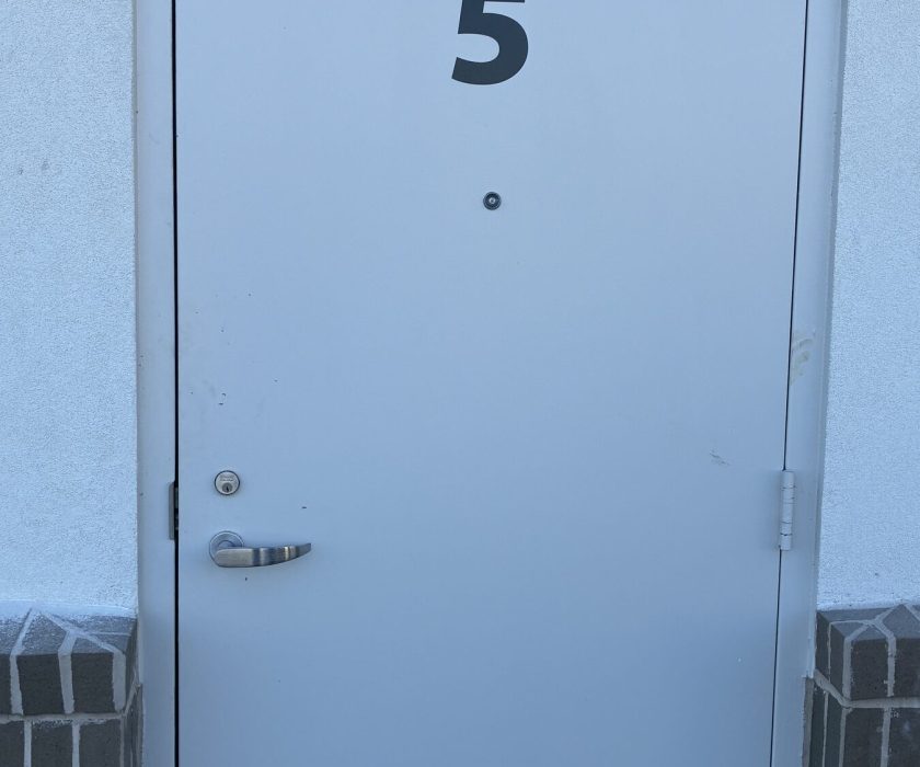 Commercial unit door secured with a new lock
