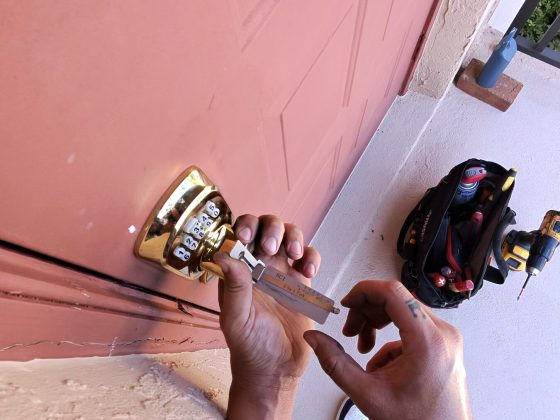 Front door lock being rekeyed on a Naples home
