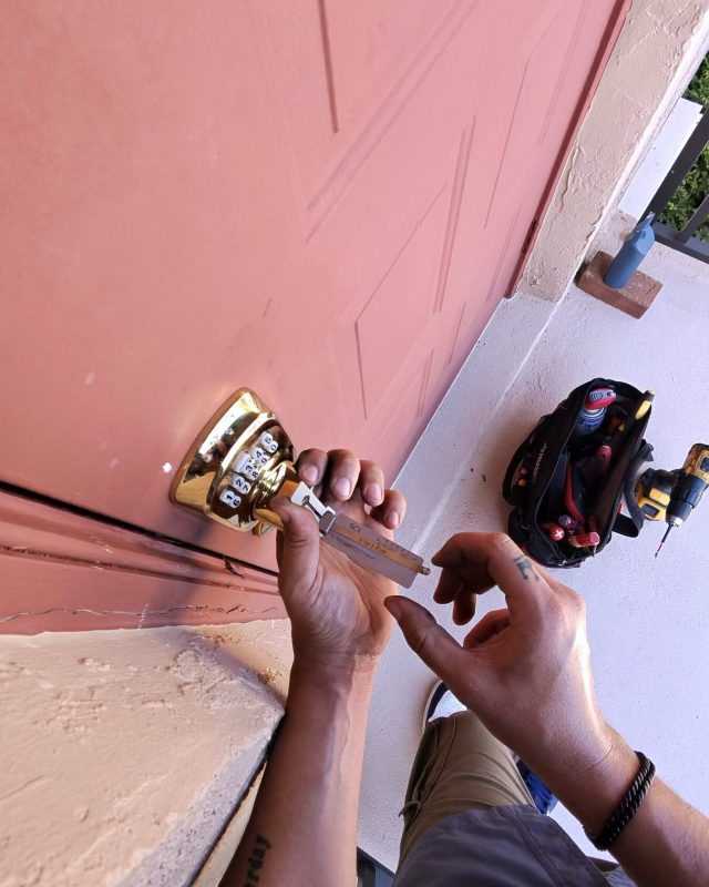 Front door lock being rekeyed on a Naples home
