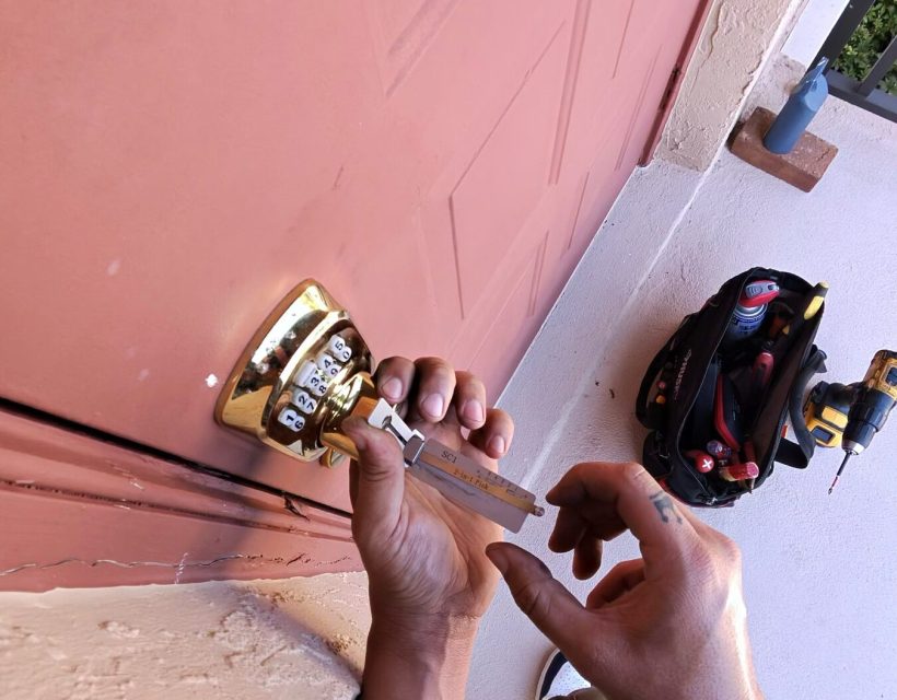 Front door lock being rekeyed on a Naples home