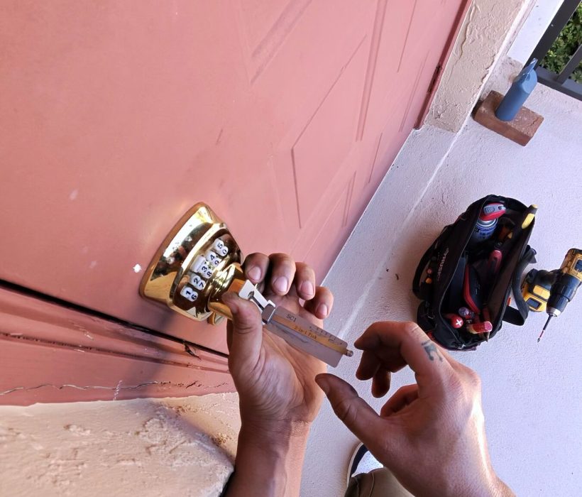 Front door lock being rekeyed on a Naples home