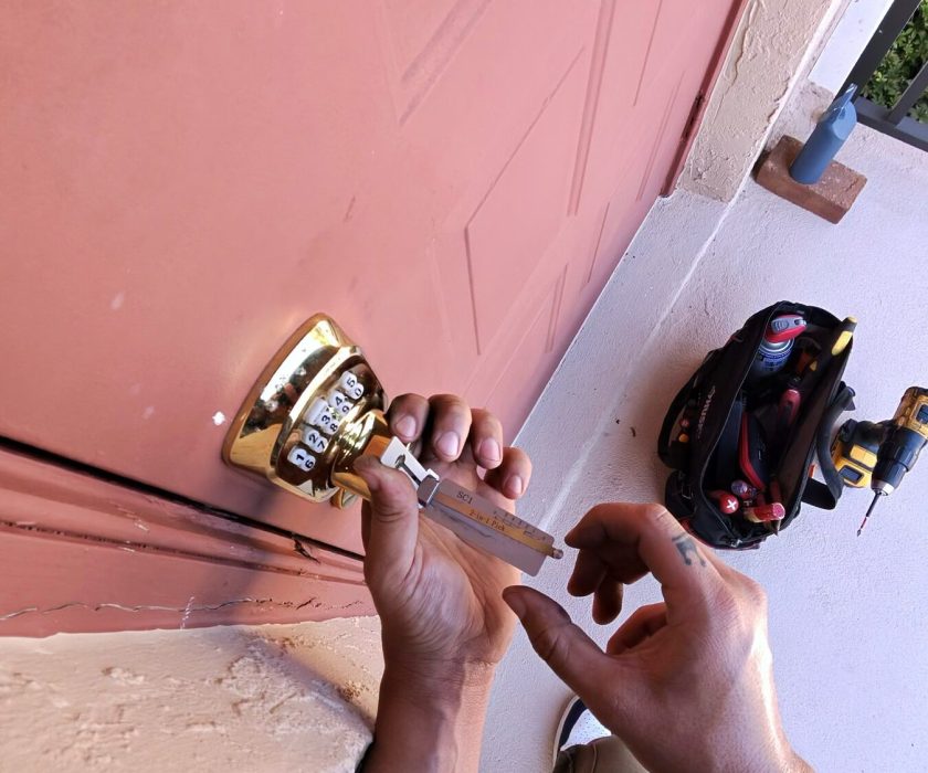 Front door lock being rekeyed on a Naples home